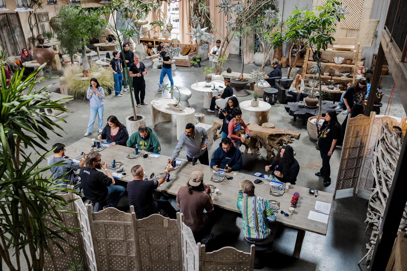 Overhead view of competitors seated at long tables on the tournament floor at Berbere Imports