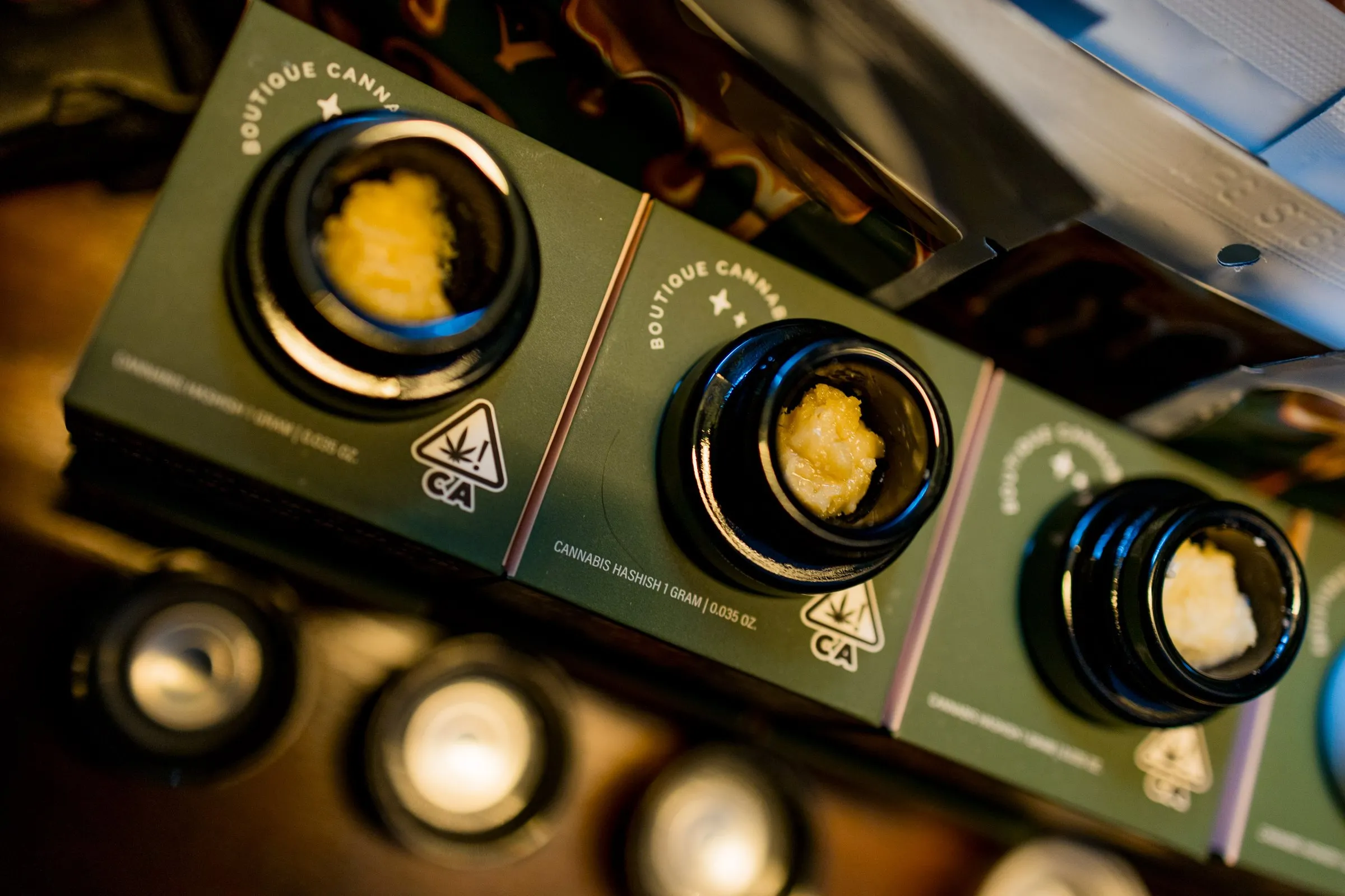 Jars of solventless hash lined up for a guided tasting
