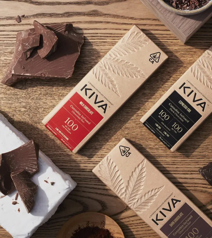 Kiva cannabis-infused chocolate bars with broken squares of chocolate